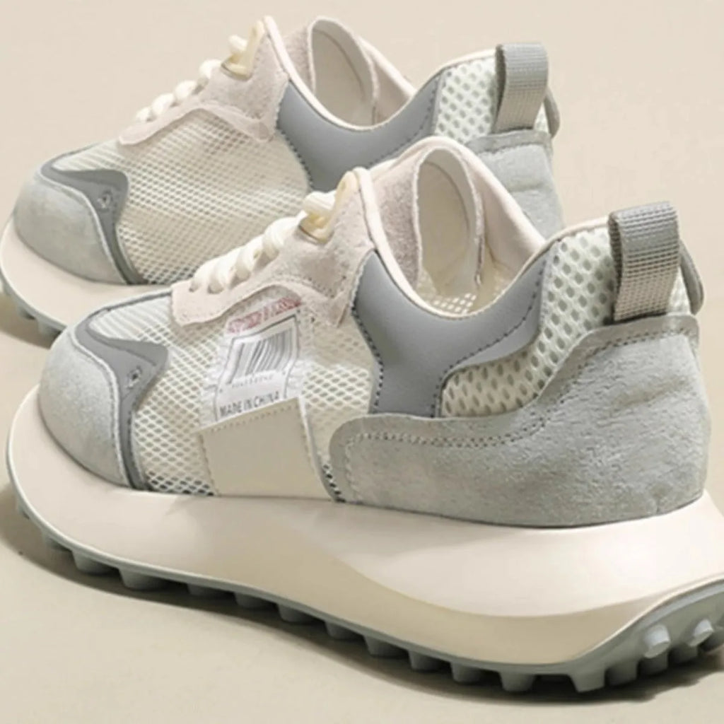 Women's grey and pink retro sneaker with low-top design and round toe