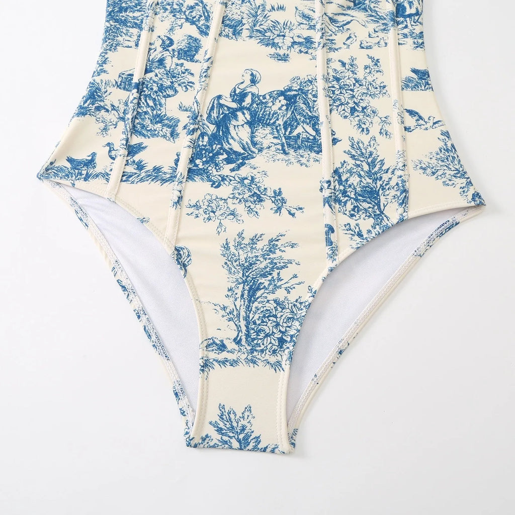 Blue patterned one-piece swimsuit for women on a mannequin, with an optional gauze skirt shown alongside.