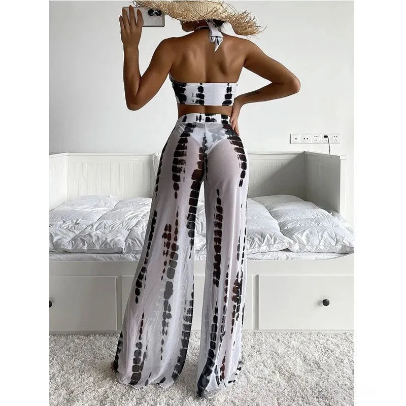 Women's black print three-piece swimsuit set with mesh trousers on hanger