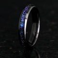 Galaxy tungsten ring with electroplated black finish and coloured inlay on a plain background