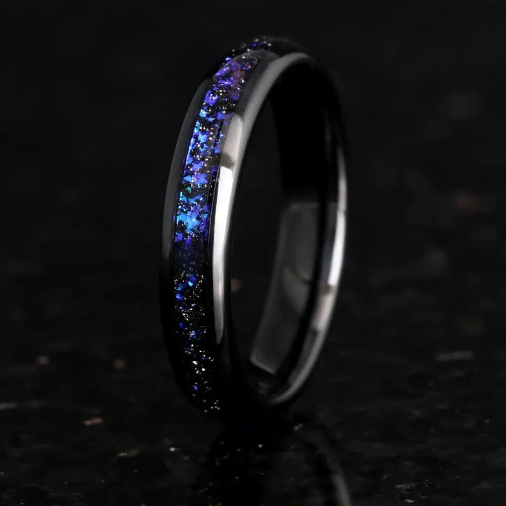 Galaxy tungsten ring with electroplated black finish and coloured inlay on a plain background