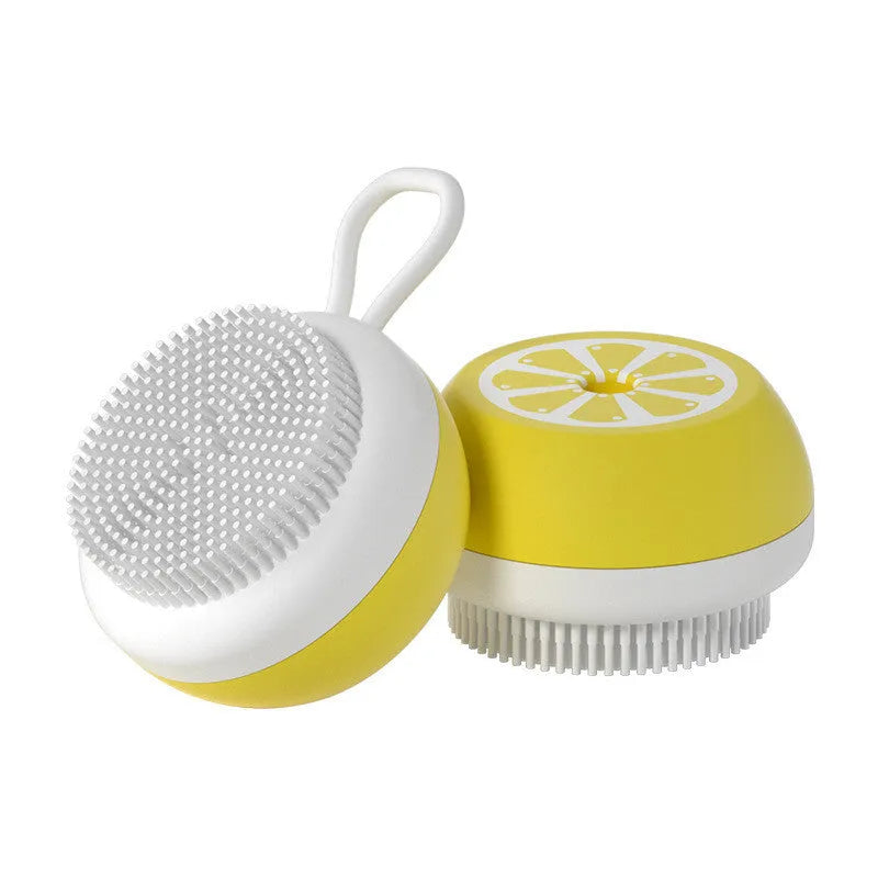 Yellow silicone pet bath brush with massage bristles and comb teeth on a blue background.