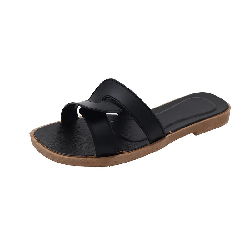 Women's white PVC cross strap toe ring sandals on a plain background