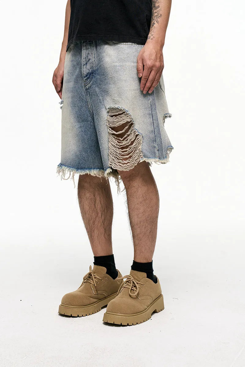Light blue retro washed men's baggy denim shorts on a mid-rise mannequin, showing wide-leg cut.