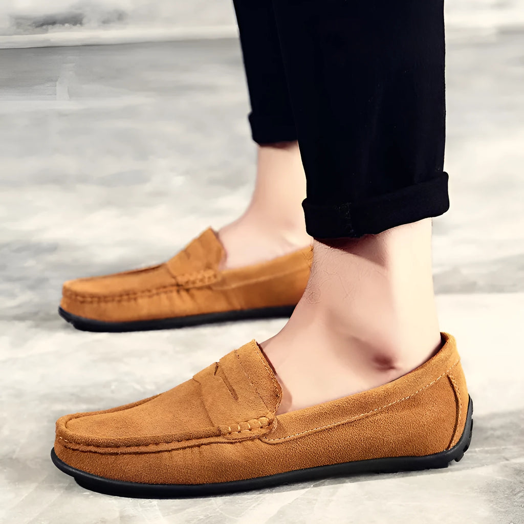 Men's brown suede Gommino-style low-top casual shoes with a round toe and flat rubber sole.