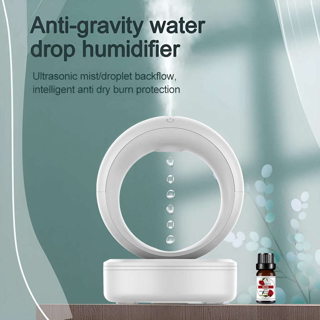 White round anti-gravity humidifier showing optical illusion of levitating water droplets on a desk.