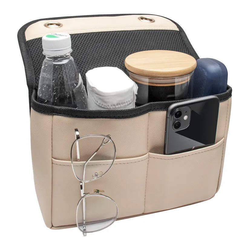 Leather car rear seat storage bag with plug-in installation, 25x16x8cm, in black on a car seat back