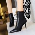 Black women's stiletto heel boots with pointed toe, back zipper, and 6-8CM heel