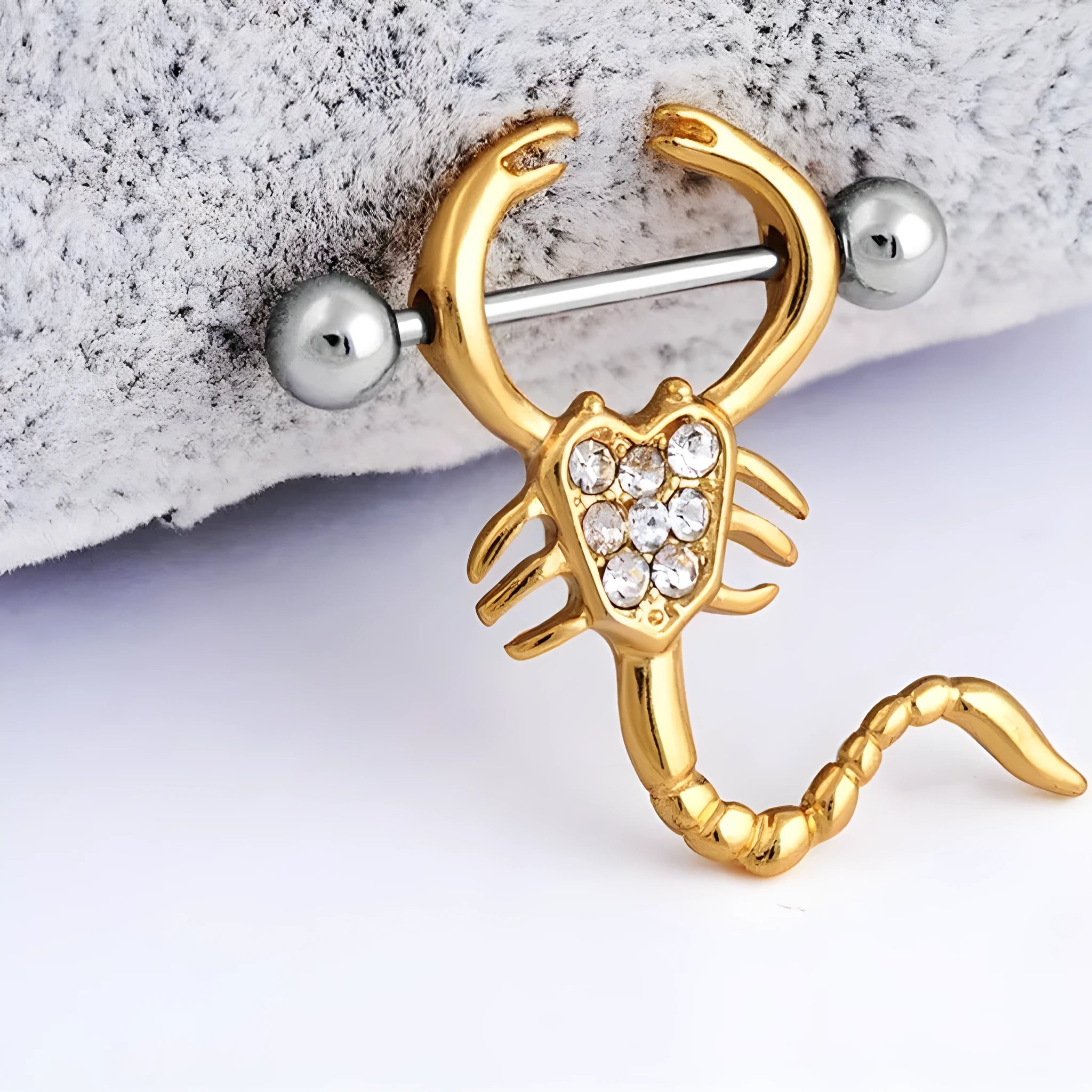 Gold scorpion belly ring with 316L medical steel bar and crystal diamond inlay on white background