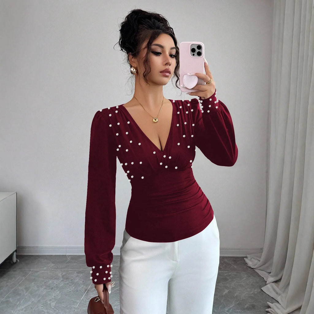 Women's V-neck solid colour fitted t-shirt with long bell sleeves in black, wine red, or apricot.