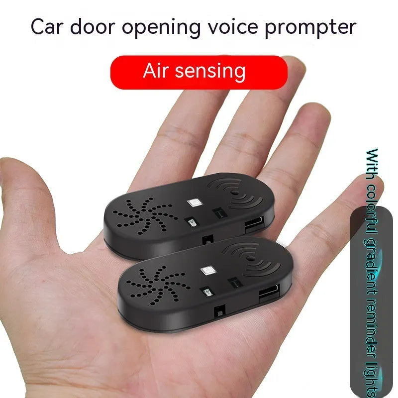 Black ABS plastic car door reminder alarm with infrared sensor and micro USB port.