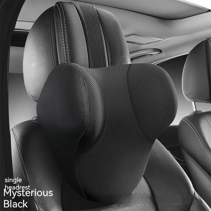 Black memory foam car headrest and lumbar support pillow set on a car seat