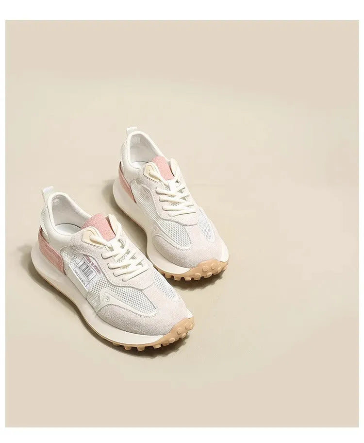 Women's grey and pink retro sneaker with low-top design and round toe
