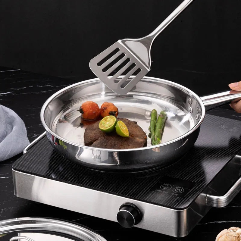 15-piece stainless steel cookware set with non-stick pans and glass lids on a kitchen counter