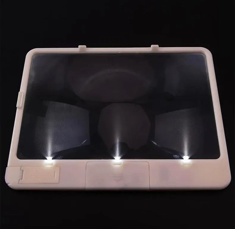 Black or white magnifying glass with integrated LED reading lamp, showing 180x140mm size and 3x magnification lens.
