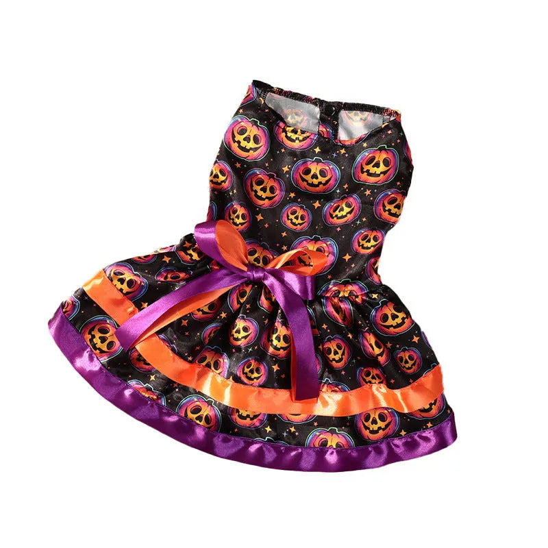 A dog wearing a double-layer orange Halloween skirt with a colourful pumpkin print.