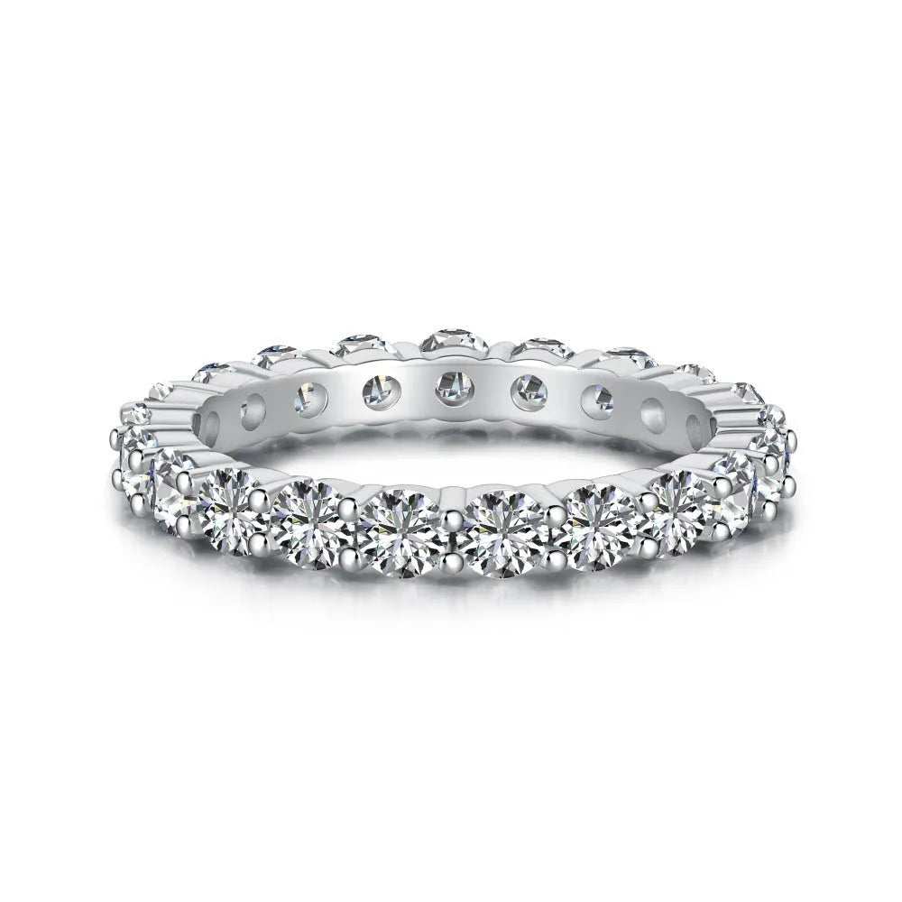 S925 sterling silver ring with geometric round design and white diamond-like stone on light background