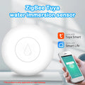 Zigbee wireless water flood sensor on a white background, showing compact size.