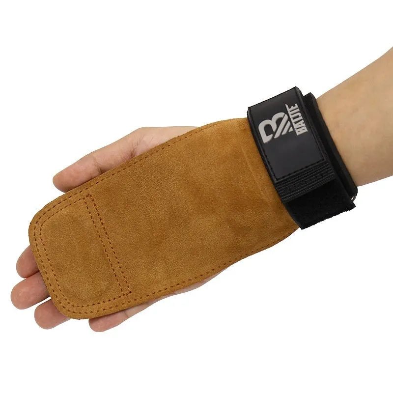 A pair of brown leather wrist protectors for fitness, shown as grip strength bands.