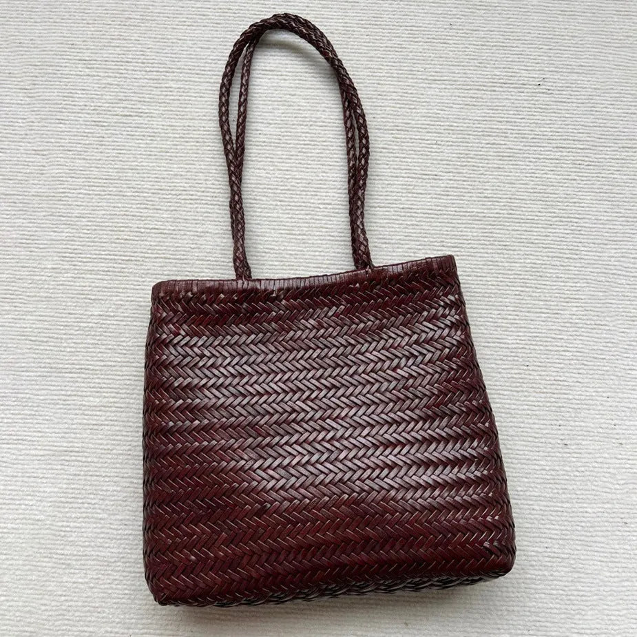 Brown handmade woven tote bag made of genuine cowhide leather with a three-dimensional pocket.