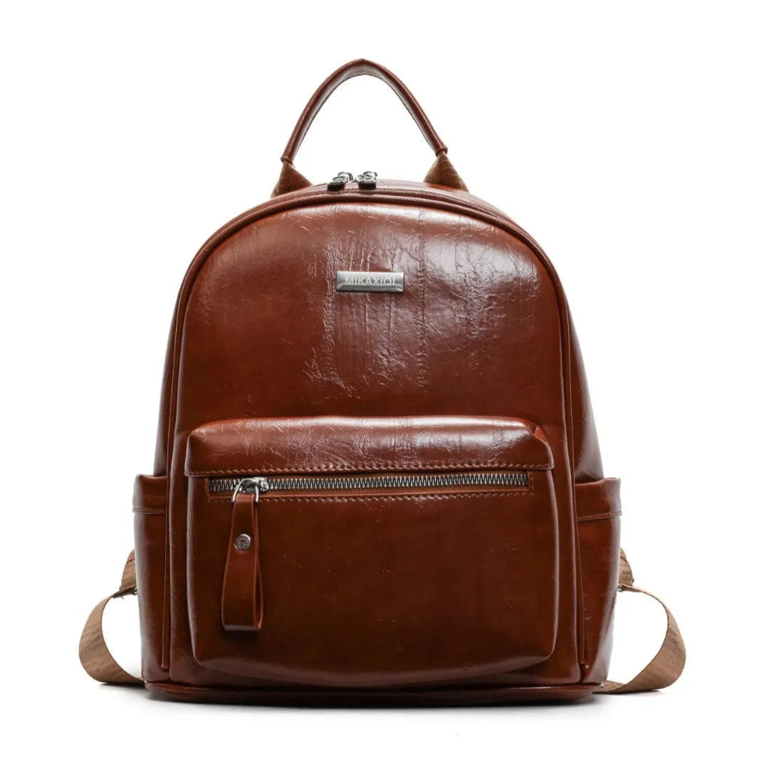 Simple fashion trendy ladies travel backpack in waterproof PU with sandwich pocket, available in multiple colours