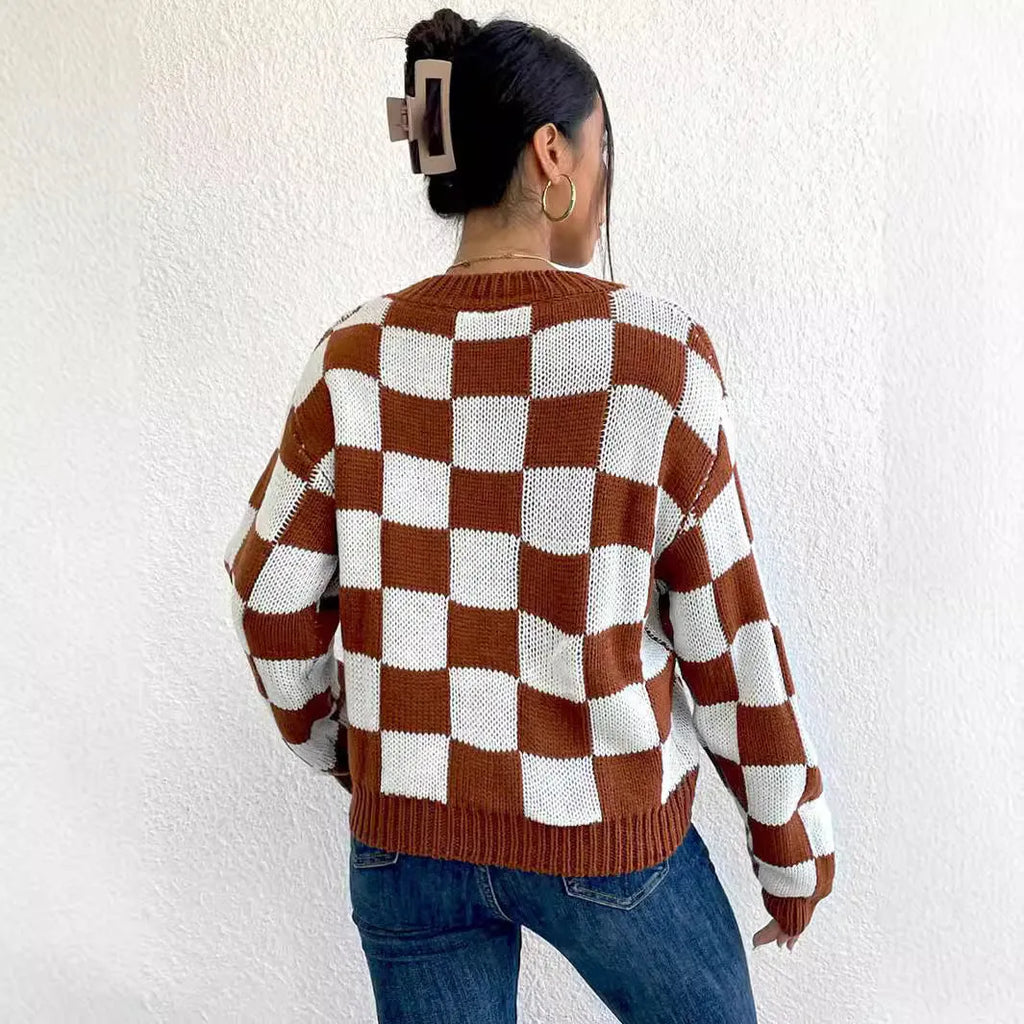 Dark brown loose-fit pullover sweater with a plaid chessboard pattern and long sleeves.