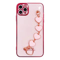 Solid colour silicone phone case with an integrated white protective bracelet on a table.