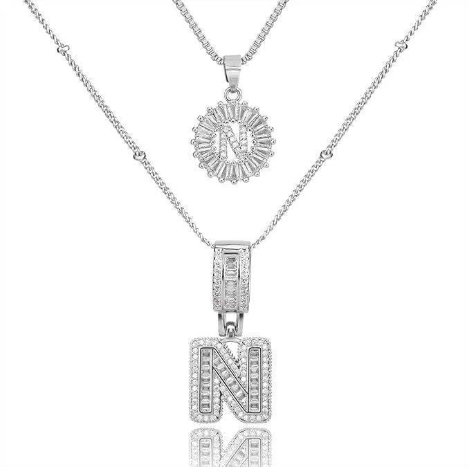 26 English letters copper-plated gold diamond initial pendant necklace with adjustable chain on display