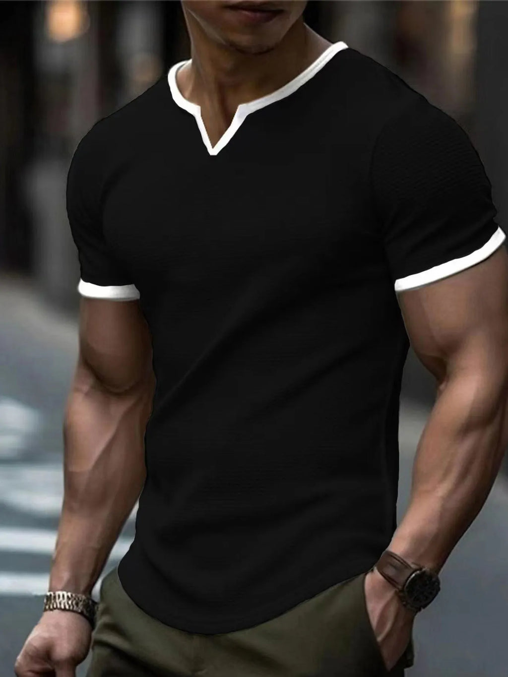 Colour-block waffle textured V-neck sports t-shirt in polyester on a size chart.