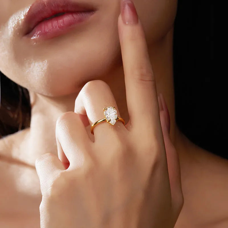 Pear-shaped moissanite ring in silver, 7x11mm stone, simple single diamond style, size 7 shown