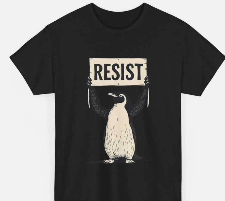 Straight cut loose fit cotton t-shirt in black on a hanger, showing round neck and short sleeves.