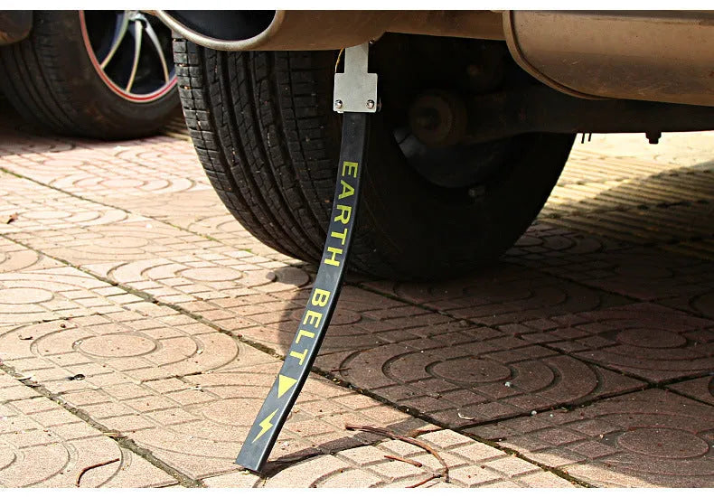 Black car electrostatic grounding belt, 37cm long with metal hook, shown against a vehicle tyre.