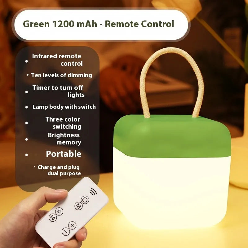 LED hanger solid color portable rechargeable light in green with remote control on a table