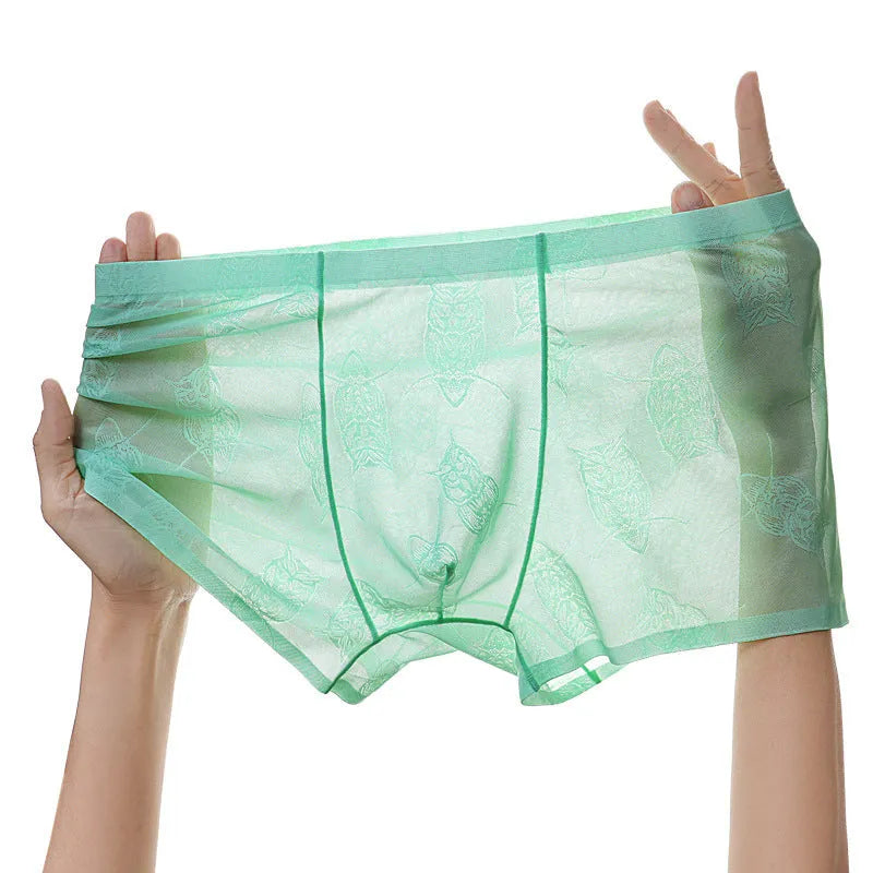 Men's ice silk seamless boxers in black, lightweight nylon fabric with mid-waist design
