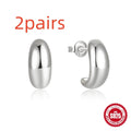 A single C-shaped glossy stud earring made of sterling silver, shown in a gold colour finish.