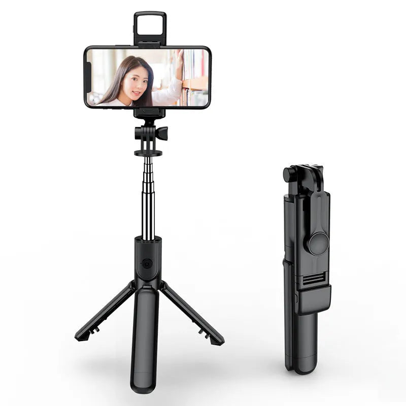 Black selfie stick tripod with wireless Bluetooth remote, universal phone holder, and optional ribbon fill light