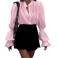Solid colour polyester women's shirt with lantern sleeves and ruffle detail, available in white, pink, and black