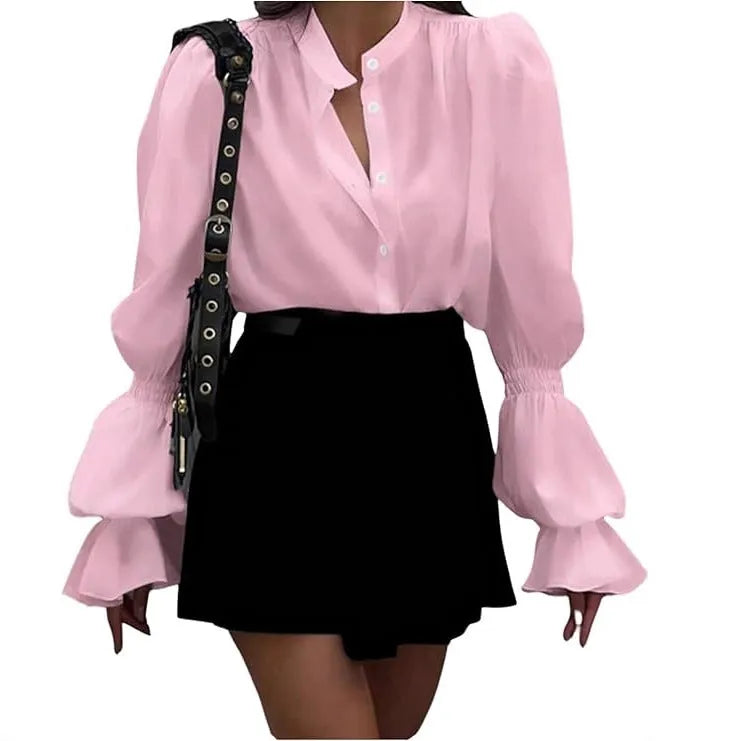 Solid colour polyester women's shirt with lantern sleeves and ruffle detail, available in white, pink, and black