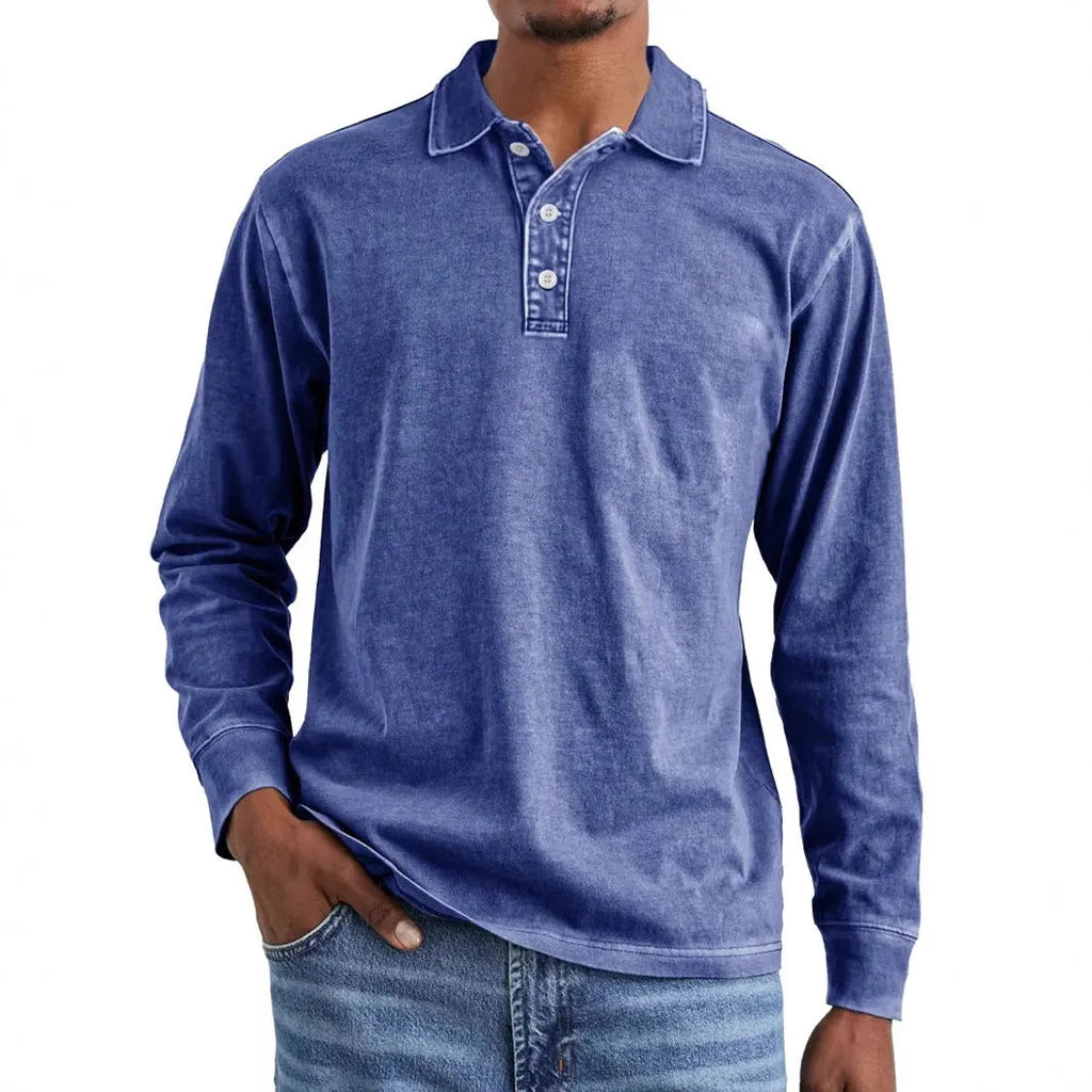 Man wearing a grey washed cotton long sleeve polo shirt with a lapel collar and subtle distressing.