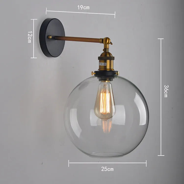 Retro-style 20cm round ball glass wall lamp with aluminium holder in amber, smoke grey, or transparent.