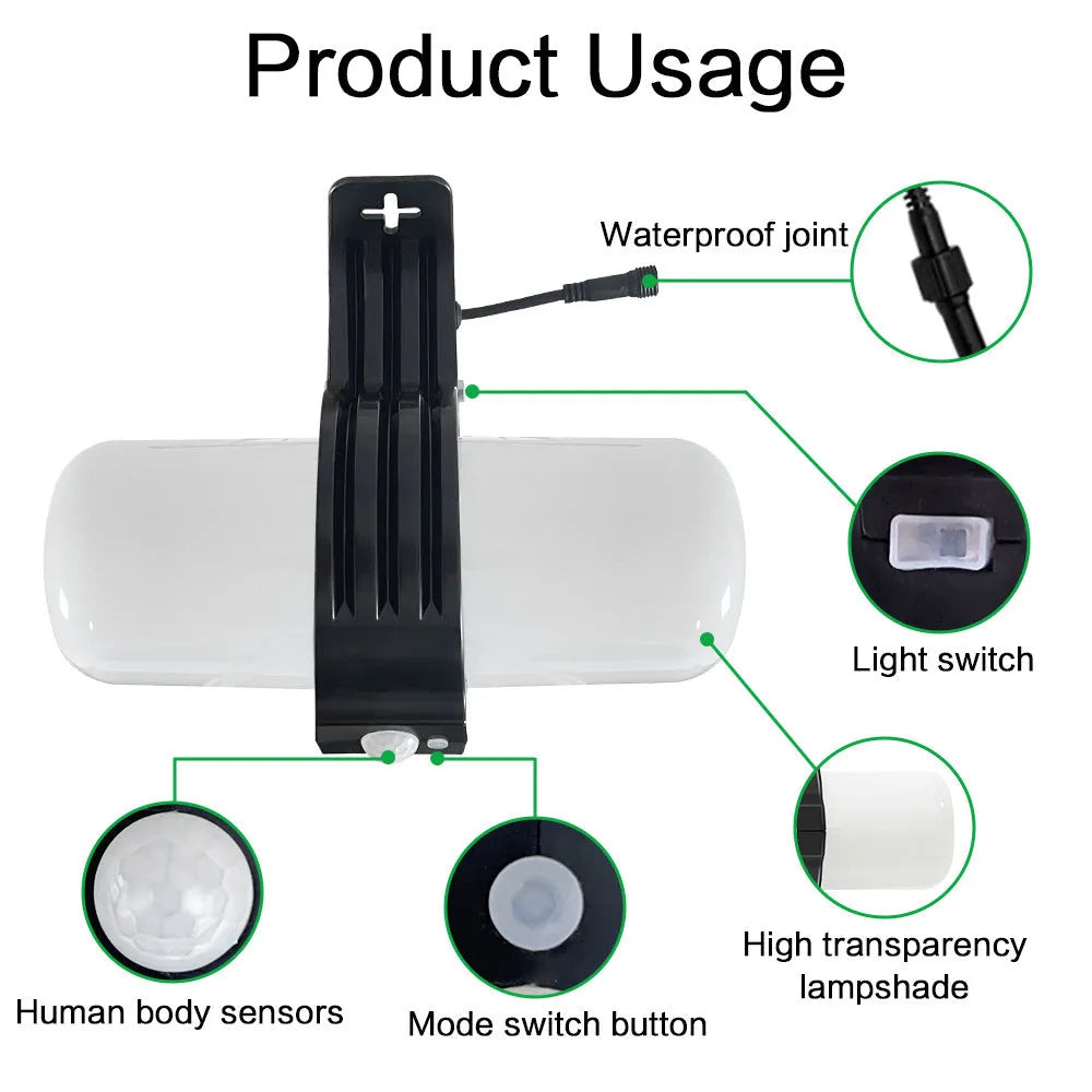 Black outdoor solar floodlight with motion sensor and abstract design mounted on wall bracket