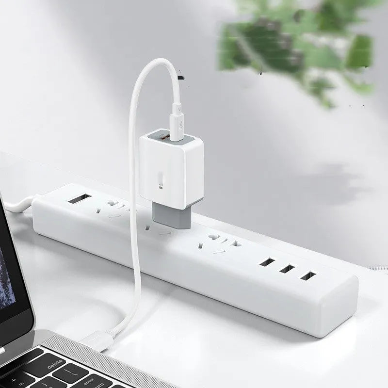 White universal phone fast charger set with compact fireproof charging head and cable.