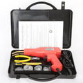Red plastic welding gun with pure copper transformer in black plastic box with nails and pliers knife