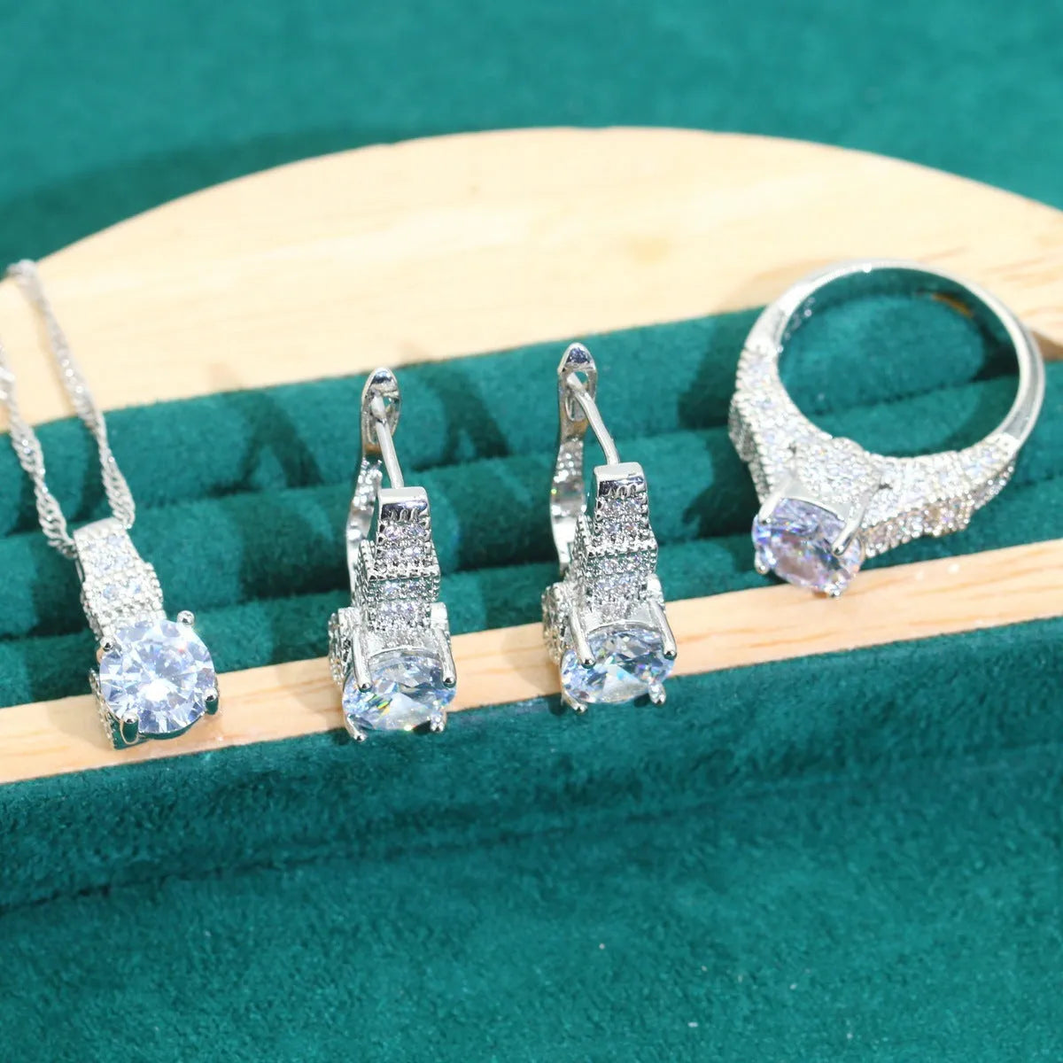 Bridal zircon jewellery four-piece set showing necklace, earrings, bracelet and ring with water wave chain