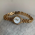 Women's gold strap alloy quartz watch with fritillary surface dial and rhinestone accents