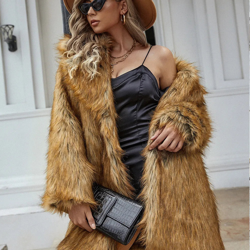 Yellow loose women's faux fur coat on a hanger, showing regular sleeves and textured fabric.