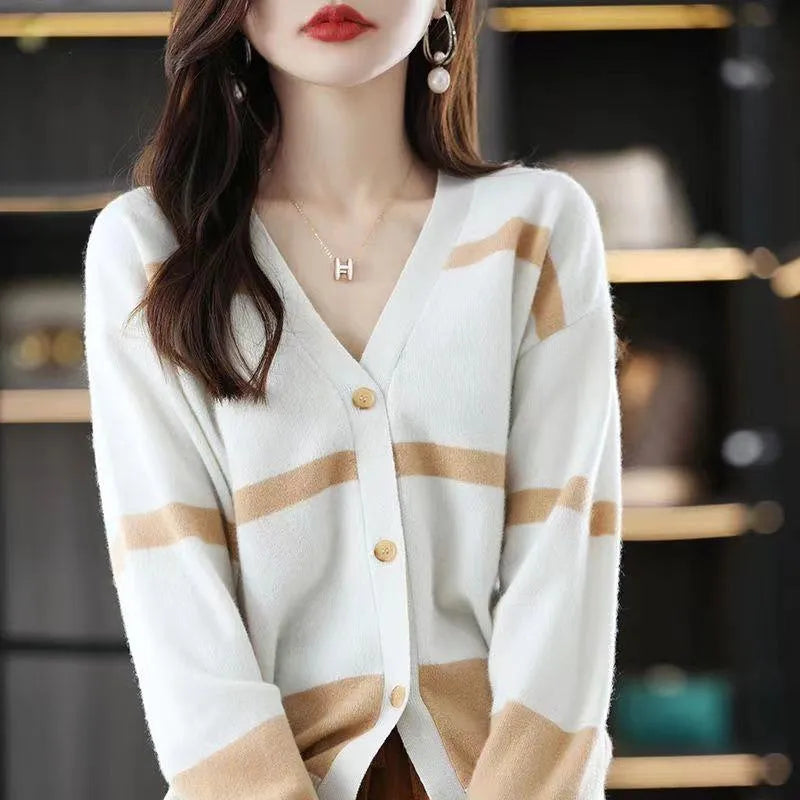 Women's striped V-neck cardigan with a raised 3D pattern, shown buttoned.