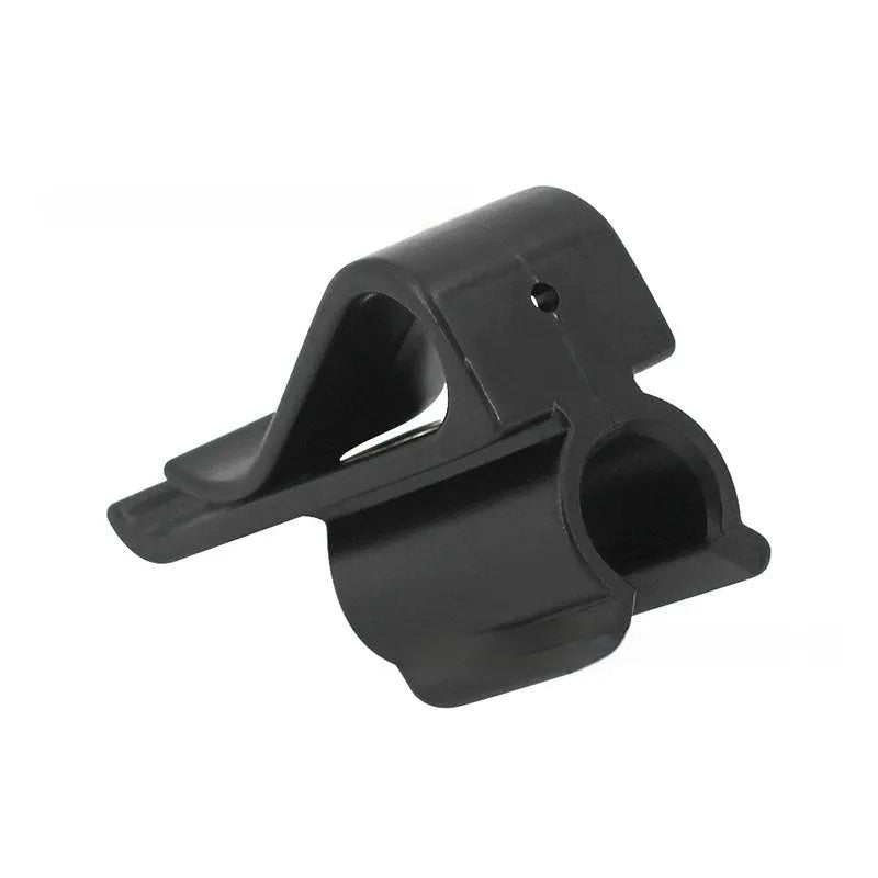 Black ABS plastic golf club clamp holding a golf club shaft