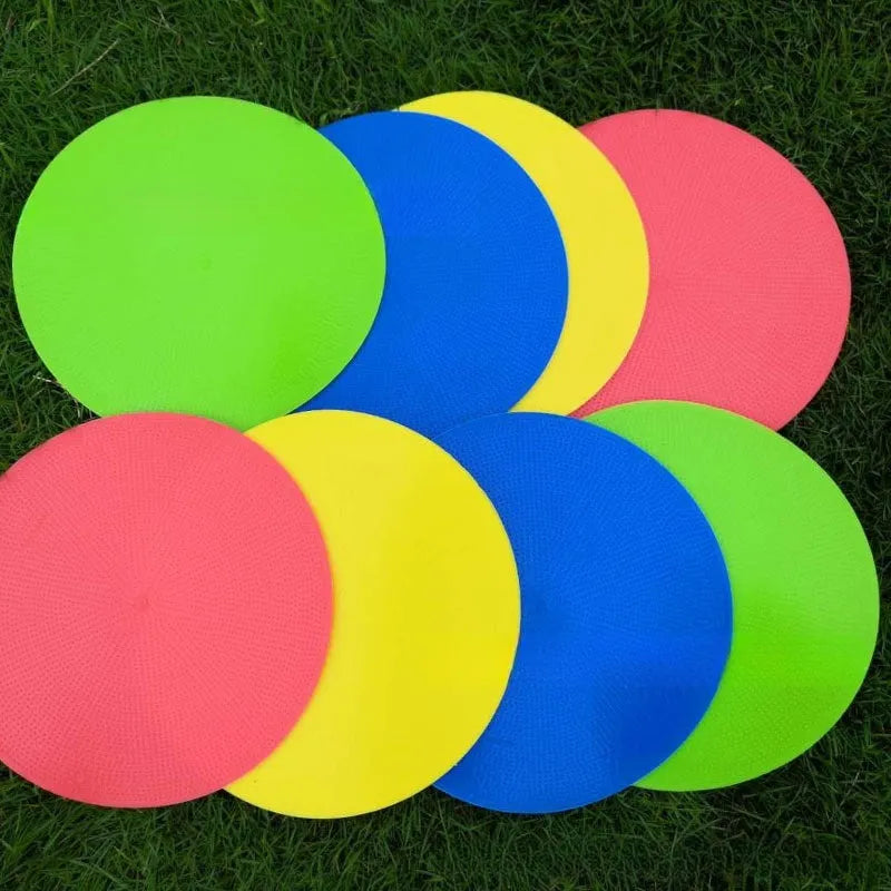 Yellow 23cm diameter flat TPE football training marker disc on grass
