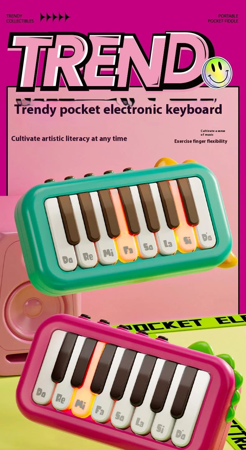 Pocket electronic keyboard little piano pattern toy for children in green and pink plastic.